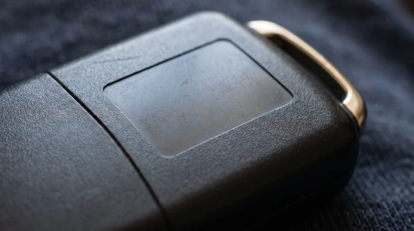 Close-up of the back of a key fob showing the regulatory label area